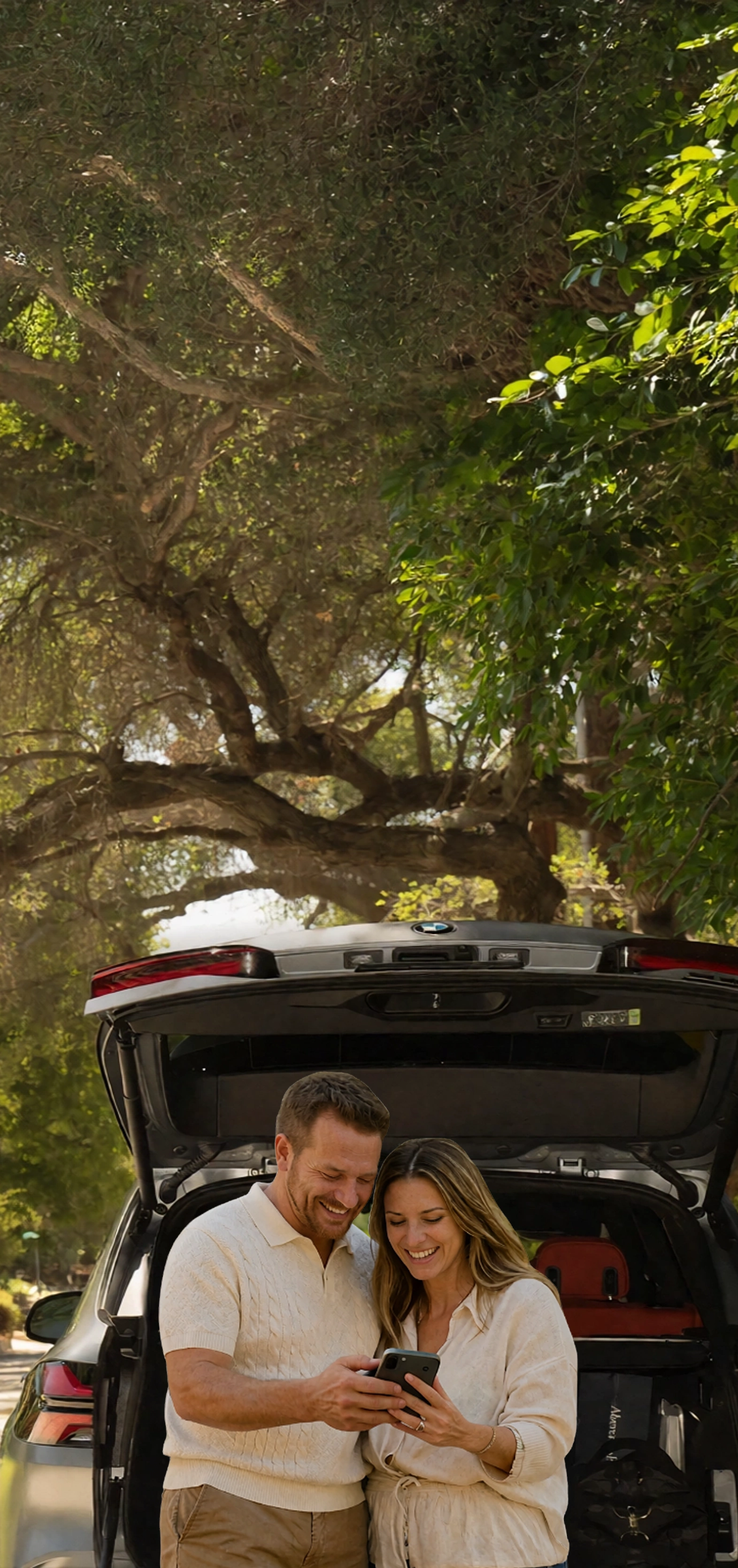 Sellers celebrating next to their sold car
